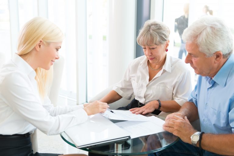 Elderly couple purchasing life insurance