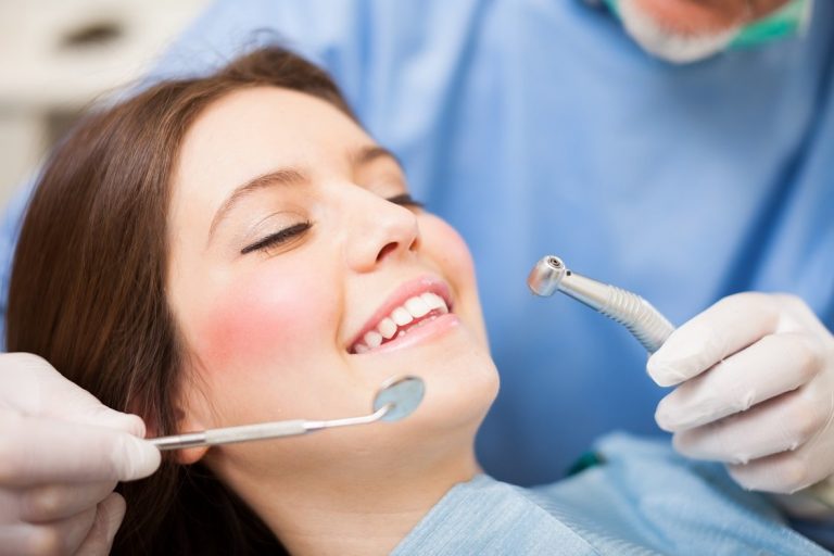 Woman receiving a dental treatment