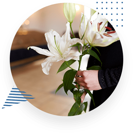 Woman Holding Flowers At Funeral