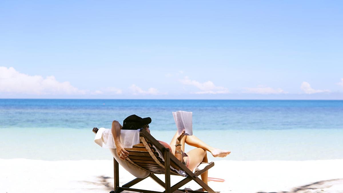 A lady enjoying her workation on the seaside