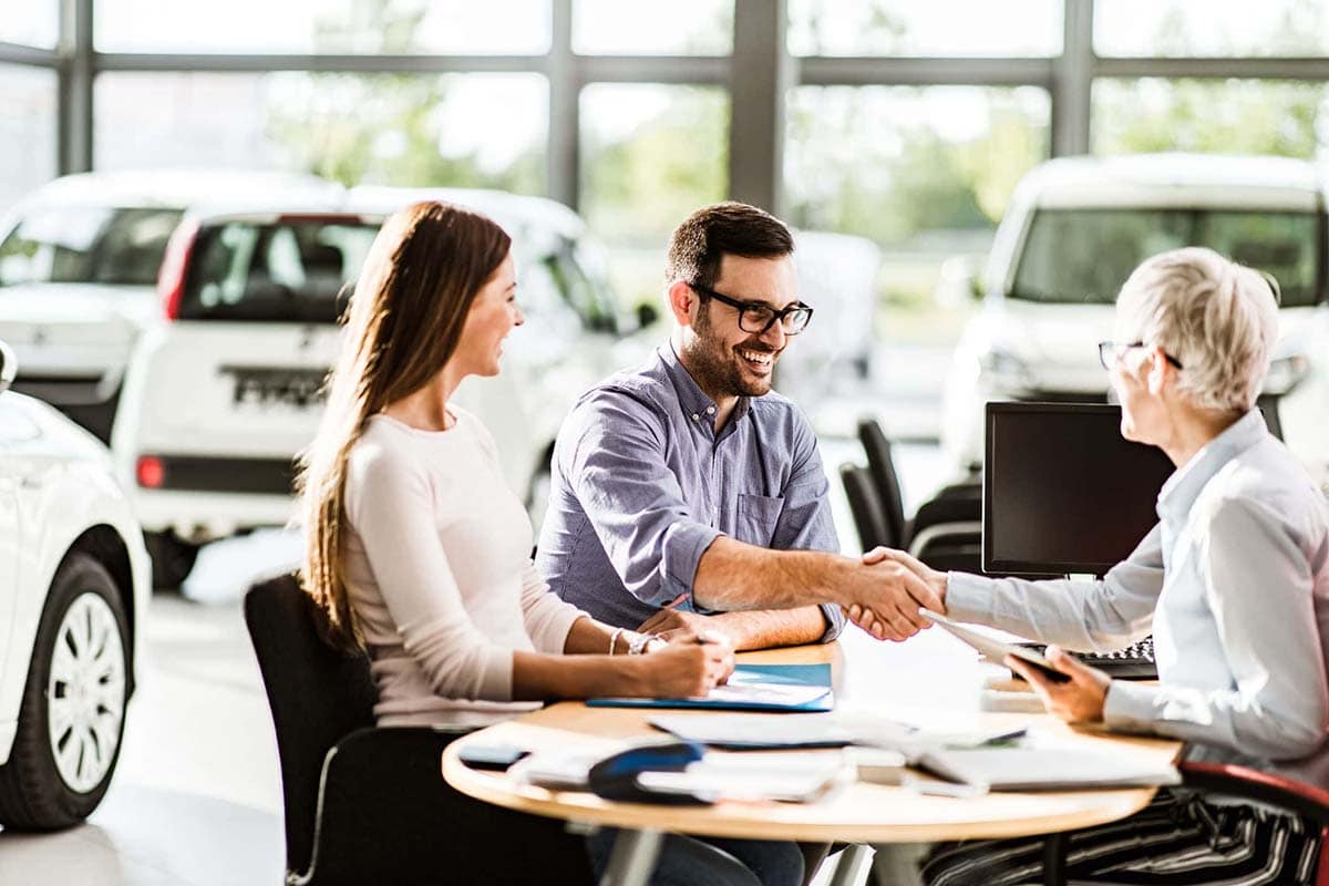 Couple with a Car Buy Image